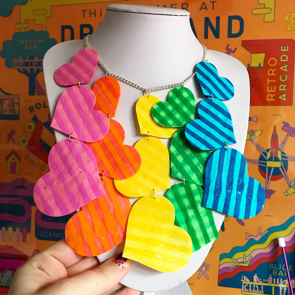 A rainbow heart statement necklace made from upcycled/recycled single use plastic straws by Lorelai 